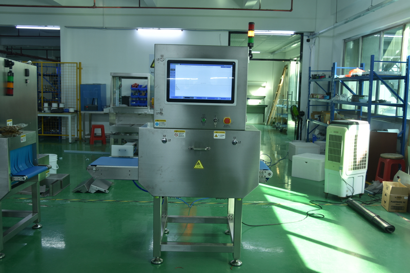 X-Ray Inspection System with Integrated Pusher for Heavy Packaging